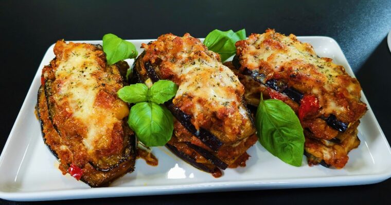 Baked eggplant with chickpea tomato sauce topped with melted cheese